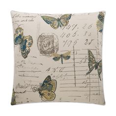 a pillow with butterflies on it and music notes in the background, as well as an envelope