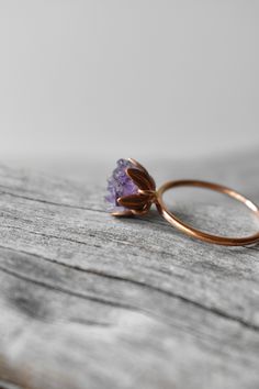 Unique Amethyst ring in my copyrighted lotus flower ring design. Uncut Amethyst gemstone (January birthstone!) set into a handcrafted rose gold fill band with 4 prongs holding a rose gold color etched cup. Each piece of rough Amethyst is placed randomly in a mosaic way. You will find a mix of light to saturated Amethyst purples. Size 5. Ready to ship worldwide in under 3 days. I love this ring as sparkly, any occasion present for her, uncut gem Amethyst engagement ring, January birthstone gift, Rose Gold Amethyst Ring Gift, Adjustable Gold Amethyst Ring Gift, Handmade Gold Amethyst Ring Gift, Minimalist 14k Gold Amethyst Ring As Gift, Flower Ring Design, Gold Faceted Amethyst Ring Gift, Unique Amethyst Ring, Holding A Rose, Unique Opal Ring