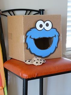 a cardboard box sitting on top of a chair