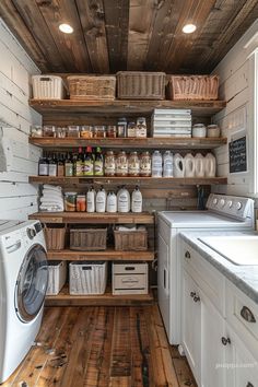 a washer and dryer in a small room with wooden shelves on the wall