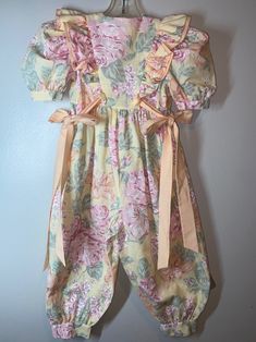 "Cute floral handmade romper /jumpsuit / No labels being handmade / True vintage measures pit to pit 13\"/ waist 12\"/ inseam 14 1/2\" / length (shoulder to bottom leg) 33\"/ smoke free environment - Amazing Seamstress a one of a kind for sure ! No issues - smoke free home (104)" Cute Spring Overalls Jumpsuits And Rompers, Cute Spring Overalls And Rompers, Pink Floral Print Jumpsuits And Rompers For Garden Party, Pink Floral Print Jumpsuits For Garden Party, Cute Bubble Romper Overall For Spring, Retro Fitted Floral Print Jumpsuits And Rompers, Retro Floral Print Fitted Jumpsuits And Rompers, Vintage Floral Print Jumpsuit For Spring, Cute Fitted Jumpsuits And Rompers With Ruffles