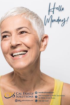 an older woman with white hair smiling at the camera while wearing a yellow tank top