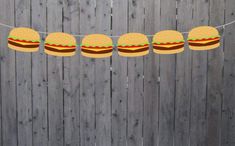 hamburger buns are hanging on a string