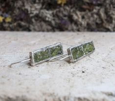 Abstract earrings Sterling silver earrings Art silver jewelry Stone peridot earrings Inlay silver earrings Handmade earrings Green stone Reach for the sun with the Peridot crystal, an effervescent stone that harnesses the life-giving energy that turns night into day. The Vitamin D of your healing crystal collection, the Peridot crystal meaning is connected to the sun, making it your spiritual cheerleader that keeps you on the sunny side of life. The Peridot crystal shines like a light beam of en Green Faceted Earrings For Anniversary, Sterling Silver Green Crystal Earrings For Anniversary, Silver Dangle Peridot Earrings, Green Multi-stone Sterling Silver Earrings, Nickel-free Green Crystal Earrings In Sterling Silver, Peridot Crystal, Abstract Earrings, Peridot Earrings, Electroformed Jewelry