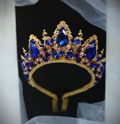 Blue tiara with crystal rhinestones. Wedding dark blue tiara entirely handmade, made of metal elements, crystal rhinestones and beads.An ideal addition to the crown will be beautiful earrings that are made of identical materials.Crown height - 2.35 inches.  Earring length - 2.15 inches.The crown is light, despite the size.______________________________________________________________• All orders from the Exclusive Wedding Shop you will receive in a FREE beautiful gift box.• Here is an approximat Blue And Gold Tiara, Dark Blue Tiara, Royal Blue Tiara, Wedding Dark Blue, Tiara Blue, Blue Tiara, Crystal Crown Wedding, 15 Birthday, Crown Birthday