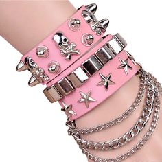 Punk E-Girl Bracelets Layered emo punk/metal style bracelets with studs, skulls, stars and chains! A great accessory for gigs and festivals. Wear them all together or separately. Length: 8.5"/21.6cm Material: Faux Leather & Metal. Closure: Adjustable Stud Clasp. Pink Emo, Leather Goth, Emo Accessories, Pastel Punk, Pink Goth, Boho Princess, Goth Accessories, E Girl, Kawaii Accessories