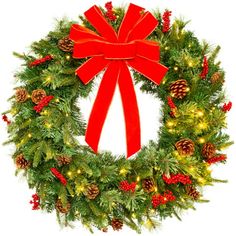 a christmas wreath with a red bow and pine cones on the front is decorated with lights