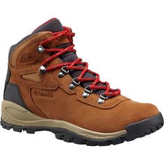 a brown hiking boot with red laces on the outstep and side zipper