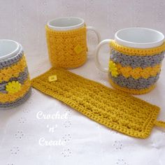 crochet coffee mug cozyies and placemats on a table