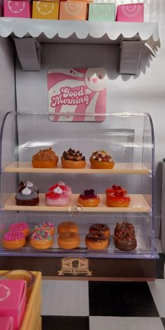 a display case filled with lots of different types of doughnuts