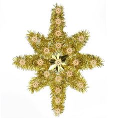 a gold and white snowflake with flowers on it's side, against a white background