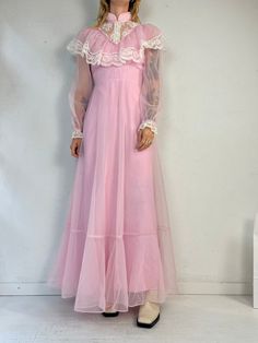 "- Vintage 1970s pink peasant dress - Long sleeves and high neckline - Zipper  up the back - Union made  - Small  Bust: 17.5\" Waist: 13\" Length: 56\"" Long Babydoll Dress, Retro Pink Dresses With Lace Trim, Pink Long Sleeve Retro Vintage Dress, Pink Fitted Victorian Dress For Spring, Vintage Pink Long Sleeve Victorian Dress, Vintage Pink Dress With Ruffles, Vintage Long Sleeve Pink Victorian Dress, Spring Pink Victorian Dress With Ruffles, 1970s Pink Long Sleeve Dress