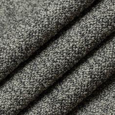 a close up shot of the texture of a gray fabric