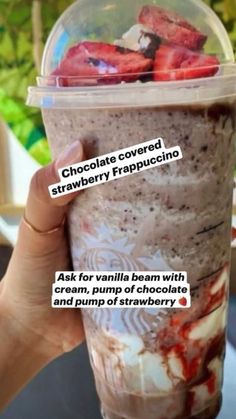 a person holding up a cup with chocolate covered strawberries in it and the words, ask for vanilla bean with cream, pump of chocolate and pump of strawberry