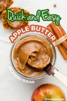 an apple butter recipe in a jar with cinnamon sticks and apples around it on a white surface