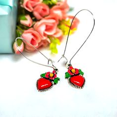 Red enamel heart earrings with long silver earwires. Mexican earrings. Mexican jewelry. Traditional Red Heart-shaped Jewelry, Red Hand Painted Earrings For Gift, Traditional Nickel-free Heart Earrings For Gift, Traditional Nickel-free Heart Earrings As Gift, Enamel Heart Charm Earrings As Gift, Enamel Earrings With Heart Charm As Gift, Adjustable Red Heart Earrings For Gift, Hand Painted Jewelry For Valentine's Day Gift, Handmade Red Heart Earrings