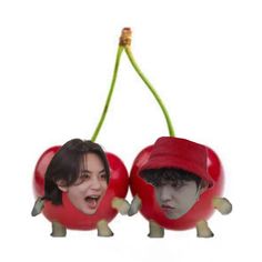 two cherries with faces in the shape of people