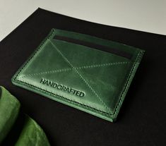 "We offer a unique custom personalized wallet with your initials! This green leather cardholder is a minimalist alternative to bulky wallets and perfect for those looking to brings a few cards and maybe some folded cash. Its comfortable design is great for daily use! It can become the best gift for someone you love. It's a lovely Mother's Day Gift idea :) PRODUCT FEATURES ♦CONTENT : - 3 card pockets which can hold 6-9 cards - 1 cash pocket ♦Wallet measures : -8 x 11 cm -or 3.32 x 4.6 inches ♦Pre Classic Green Wallets As Gift, Green Bifold Card Holder As Gift, Green Rectangular Card Holder For Personal Use, Green Wallet With Rfid Blocking As A Gift, Green Rfid Blocking Wallet As Gift, Green Wallets With Card Slots For Gift, Green Wallets With Card Slots As A Gift, Green Rfid Blocking Card Holder Gift, Green Leather Wallets For Gift