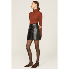 Black leather (50% Recycled Leather, 30% Polyurethane, 10% Viscose, 10% Polyester). A-line. Front button closure. 16" from waist to hemline. Made in the USA of imported fabric. Chic Asymmetrical Mini Skirt For Fall, Fall Leather Flared Skirt, Chic Leather Mini Skirt For Fall, Leather Flared Skirt For Fall, Elegant Leather Mini Skirt For Fall, Brown Asymmetrical Mini Skirt For Fall, Winter Workwear Faux Leather Mini Skirt, Modern Office Skirt For Fall, Trendy Leather Lined Skirt