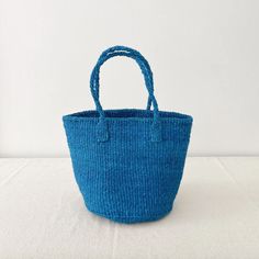 a blue bag sitting on top of a white table