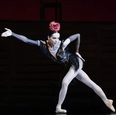 a ballerina in black and white is performing