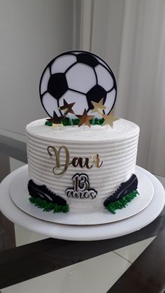 a soccer themed birthday cake on a table