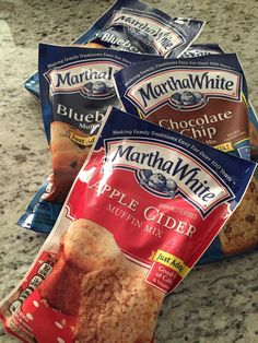 three bags of martha white apple cider muffin mix sitting on a counter top