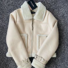 Brand New Never Worn. Very Soft! Ships Immediately! Us 4 Uk 8 Eu 36 Spring Leather Jacket With Faux Fur Trim, Spring Workwear Leather Jacket With Faux Fur Trim, Trendy Cream Long Sleeve Leather Jacket, Cream Outerwear With Faux Fur Lining For Spring, Chic Cream Outerwear With Zipper Closure, Long Teddy Coat, Chic Black Outfits, Pink Puffer Coat, Cape Blazer