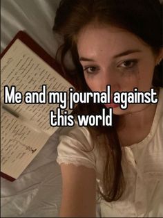 a woman laying in bed next to an open book with the caption me and my journal against this world