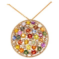 18K rose gold pendant is from Riad Collection. This beautiful pendant is made from round shape multi-coloured sapphires in total of 20.51 Carat and white diamonds in total of 3.76 Carat. Total metal weight is 21.50 gr. The diameter of the pendant is 4.5cm. Rose gold chain is 70 cm long. Perfect for any great occasion! The Riad Collection is the spring/summer 2022 collection of Vitale 1913. Inspired by the colorful oriental gardens of Marrakech, and their geometric shapes, Riad recalls our deep M Gold Diamond Drop Earrings, Round Diamond Pendant, Sapphire Diamond Pendant, Antique Jewellery Designs, Colorless Diamond, Rose Gold Chain, Rose Gold Pendant, Elegant Pendant, Sapphire Pendant