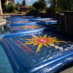 inflatable sun signs on the side of a swimming pool