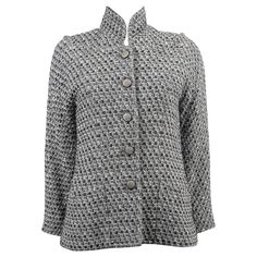 100% authentic Chanel lurex tweed jacket in black, cream, grey and silver wool (39%), viscose (27%), nylon (20%) and acrylic (14%). Features a stand-up collar, as well a second almost off the shoulder neckline, raglan sleeves and two open pockets at the waist. Closes with silver chain buttons on the front. Lined in silk (100%) with chain along the hem. Has been worn and is in excellent condition. 2013 Paris-Edinburgh Metiers d'Art Measurements Model 13A P46623 V34632 Tag Size 46 Size M - L Shoul Chanel Blazer, Chanel Coat, Chanel Black And White, Chanel Black, Outerwear Coats, Vintage Chanel, Tweed Jacket, Black Coat, Raglan Sleeve