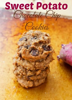 a stack of cookies sitting next to a purple potato