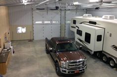 an rv and truck are parked in a garage