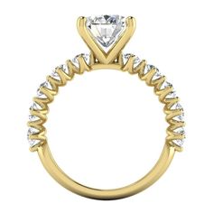 a yellow gold engagement ring with a princess cut diamond in the center and side stones