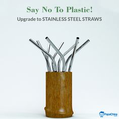 there is a wooden container with silver steel straws in it that says say no to plastic upgrade to stainless steel straws