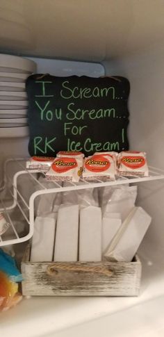 an open refrigerator filled with ice cream and yogurt