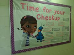 a bulletin board with the words time for your checkup and an image of a cartoon character