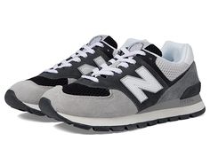 New Balance Classics 574D Rugged - Men's Shoes : Black/Grey : Retro-inspired style meets modern comfort with the New Balance Classics 574D Rugged sneaker, elevated in bold, varsity colorways. Low-top sneaker silhouette with full-lace closure. Leather and textile mesh upper with triple-stacked N logo. Padded collar and tongue for secure fit. Breathable textile lining. Removable, cushioned textile insole. ENCAP midsole cushioning combines lightweight foam with a durable polyurethane rim. Durable r New Balance Mens Shoes, Sneaker Silhouette, Mens New Balance, New Balance Classics, N Logo, Mens Shoes Black, New Balance Black, Rugged Men, Lace Closure