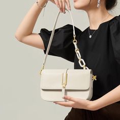 Discover Elegance and Versatility Step into the season with sophistication using our exclusive White Leather Crossbody & Shoulder Bag. Designed for the fashion-forward woman, this bag embodies elegance and versatility, perfectly complementing your spring and summer wardrobe. Whether you're attending a daytime event or an evening soiree, this bag seamlessly adapts to all occasions, ensuring you always step out in style. Premium Quality and Design Crafted with genuine cow leather, this bag boasts a soft, luxurious texture that's both durable and stylish. The saddle shape design, combined with a solid pattern and a flap pocket exterior, offers a classic yet contemporary look. Its multiple interior compartments, including a slot pocket, zipper pocket, and a spacious main compartment, provide a Luxury Handheld Baguette Bag For Office, Luxury Shoulder Bag With Single Strap And Top Handle, Luxury Satchel Bag With Single Shoulder Strap, Evening Satchel Bag With Detachable Strap, Spring Crossbody Evening Bag For Daily Use, Office Bags With Detachable Handle For Spring, Office Bag With Detachable Handle For Spring, Top Handle Bag With Single Shoulder Strap For Spring, Elegant Canvas Shoulder Bag For Travel