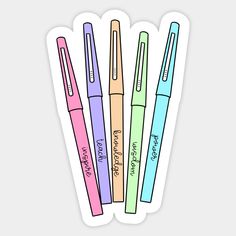 four different colored pens with writing on them