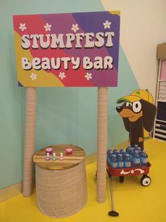 a sign that says stumpfest beauty bar next to a toy wagon with toys on it