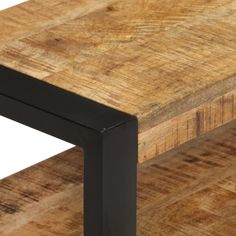 a wooden table with black metal legs