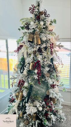 a decorated christmas tree with bells and ornaments