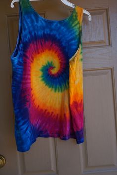 "Vintage size XL tie dye tank top. Measurements taken across front lying flat 26\" across front armpit to armpit -doubles to 52\" 28\" length Ready to ship!!" Multicolor Hand Dyed Tops For Summer, Hand Dyed Multicolor Sleeveless Tops, Multicolor Hand Dyed Sleeveless Tops, Multicolor Sleeveless T-shirt For Summer, Multicolor Hand-dyed Sleeveless Top, Multicolor Sleeveless Hippie Vest, Rainbow Sleeveless Top For Summer, Acid Wash Hand Dyed Sleeveless Top, Hand Dyed Acid Wash Sleeveless Top