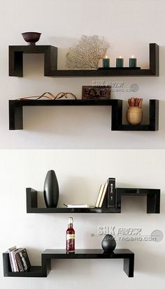 two black shelves with books and vases on them