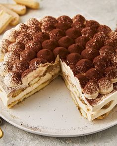 a cake on a plate with one slice cut out