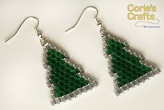 'Tis the season! Looking for a great Christmas present? Look no further! This listing is for one pair of holiday beaded earrings. To create these adorable handmade beaded earrings, I weaved transparent matte green and silver size 8/0 miyuki delica beads on white miyuki jewelry thread with a cross-section of 9 beads at the widest point (the base of the Christmas Tree).  ♥These Christmas Tree earrings measure 4 cm without the hooks are made with white miyuki jewelry thread, and weigh 3 grams. These beaded Christmas Tree earrings available in a variety of colors. You can find other varieties at the links below https://www.etsy.com/listing/736545718/beaded-christmas-tree-earrings-holiday https://www.etsy.com/listing/736239360/beaded-christmas-tree-earrings-holiday https://www.etsy.com/listing/ Beaded Christmas Tree Earrings, Beaded Hair Clips, Holiday Beading, Christmas Tree Earrings, Xmas Stockings, Handmade Earrings Beaded, Christmas Bead, Holiday Earring, Earring Tree