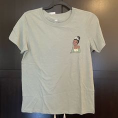 a white t - shirt with an image of a woman's face on it