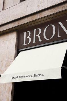 a brown and white awning on the side of a building that says bron